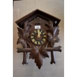 20th Century Black Forest wall clock, together with a Continental walnut three train mantel clock