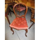 Set of four Victorian mahogany balloon back dining chairs with overstuffed seats and cabriole