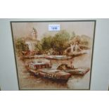 Pair of framed watercolours, river scene with moored boats and busy town scene with figures,