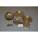 Pair of silver scallop shaped dishes, various silver and white metal trinket dishes, wine label