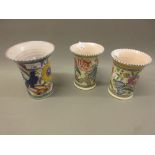 Three Poole pottery bird and floral decorated flared rim vases