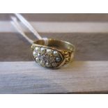 18ct Yellow gold ring set with three small central diamonds surrounded by split seed pearls