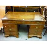 Early 20th Century burr walnut twin pedestal desk in early 18th Century style, having brown