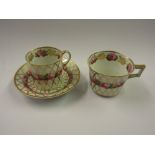 18th Century Derby trio painted with a band of roses and gold trellis work Wear to gilding, no