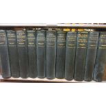 H.G. Wells, eleven volumes, housed in a small table top oak bookcase, together with a quantity of