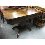 Regency rosewood fold-over card table with a square baluster column support and quadruped base