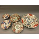 Large Imari charger with floral and bird decoration, four other Japanese Imari items, pair of