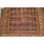 Afshar rug with an all-over repeating design on a blue ground with borders (worn), 181cms x 120cms