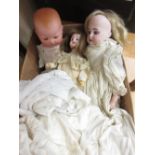 Small Armand Marseille bisque headed baby doll (at fault), together with another small German bisque