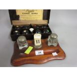 Late Victorian walnut two bottle inkstand together with a set of carpet bowls