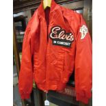 Elvis Presley in Concert tour jacket with T.C.B. embroidered badge