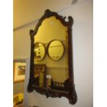 Small walnut shaped edge wall mirror with shell surmount