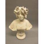 Art Nouveau style painted stoneware bust of a girl wearing a floral head band, 13.5ins high