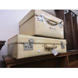 Two early 20th Century white leather suitcases bearing owners initials