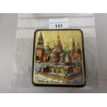 Russian rectangular papier mache box, the hinged cover painted with churches