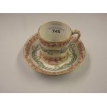 18th Century Sevres porcelain cabinet cup and saucer painted with bands of flowers and garlands,
