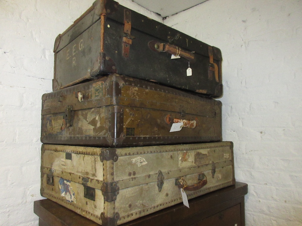 Quantity of various luggage including a vellum suitcase, smaller leather suitcases, Gladstone bag (