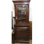 Victorian mahogany narrow bookcase with a moulded cornice above glazed door, the base with an ogee