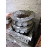 Pair of small re-constituted stone garden pots and another similar