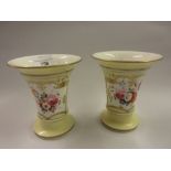 Pair of 19th Century English porcelain flared rim vases painted with a panel of flowers on a pale