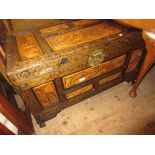 Late 20th Century carved Chinese trunk with hinged cover on low supports