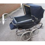 Silver Cross Balmoral pram circa 1963 with blue coach work and original hood and waterproof cover,