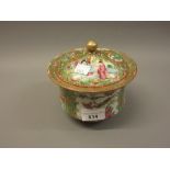Small 19th Century Canton famille rose jar and cover decorated with panels of figures and flowers,