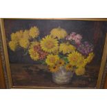 G. Peskett, oil on canvas board, still life, yellow flowers in a jug on a table top, signed, 16ins x