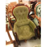 Victorian carved mahogany green button upholstered spoon back armchair on cabriole front supports