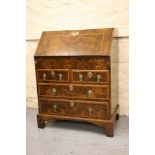 Small George I walnut and herringbone line inlaid bureau, the fall front enclosing a fitted interior