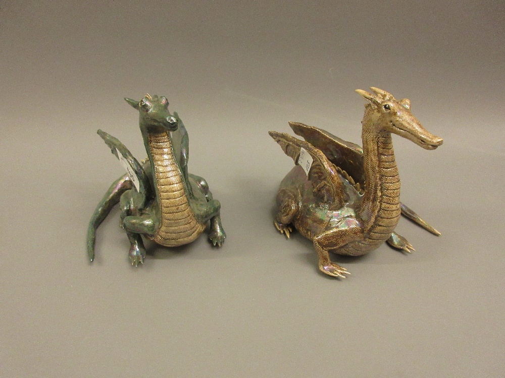 Pair of 20th Century lustre decorated pottery figures of dragons