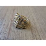 Large 18ct yellow gold ring set with twenty three natural coloured brilliant cut diamonds,