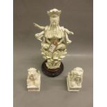 19th Century Chinese blanc de chine figure of a seated deity with detachable arms and a carved