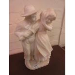 Carved alabaster group of a boy and girl, 15ins high