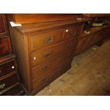 Late 19th Century walnut chest of two short and three long drawers with brass handles, on a plinth