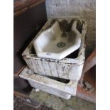 Two small ceramic sinks (at fault), together with a ceramic drinking fountain