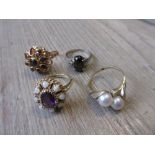 14ct Gold dress ring set amethyst and opals together with three other 14ct gold dress rings