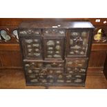 Oriental black lacquered metal mounted table cabinet with an arrangement of drawers and doors