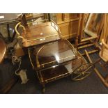 Mid Century gilt brass and lacquer work three tier drinks trolley