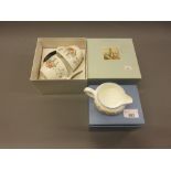 Two boxed Wedgwood Peter Rabbit cups and saucers, together with similar boxed jug
