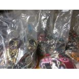 Seven bags containing a large quantity of various costume jewellery including bracelets,