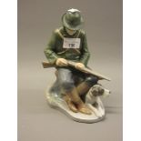 Royal Copenhagen figure of a hunter with dog by C. Thomsen, No. 1021084