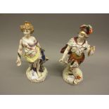 Pair of 19th Century Naples porcelain figures of classical female with a peacock and a man holding a