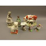 Staffordshire pottery cow and calf group together with a Pratt ware type figure of a lady archer (at