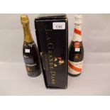 One bottle, La Grande Dame Champagne and two further bottles of Champagne in a wooden case The