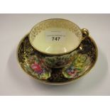 19th Century Minton cabinet cup and saucer painted with panels of flowers within gilt and dark
