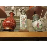 Three oriental porcelain table lamps with shades The red lamp has a large crack and has been