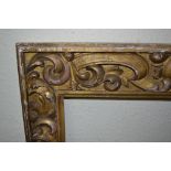 18th / 19th Century carved giltwood frame, having carved C-scroll decoration, aperture size 36ins