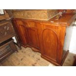 Victorian mahogany sideboard above centre shaped drawer and cupboard door, flanked by two further