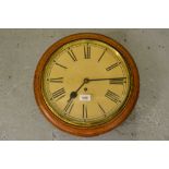 Early 20th Century oak cased wall clock having brass bezel with 11.5in paper dial with Roman